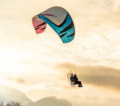 Aerial view of a paramotor pilot in flight using ITV Piper paramotor wings.