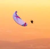 Aerial view of a paramotor pilot in flight using ITV Wasabi paramotor wings.