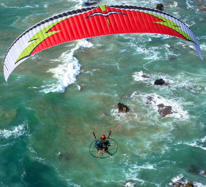 Aerial image of a paramotor pilot flying with MAC Para Samurai wings.