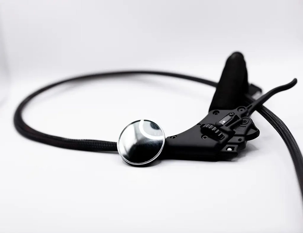A mirror accessory to attach to a paramotor throttle