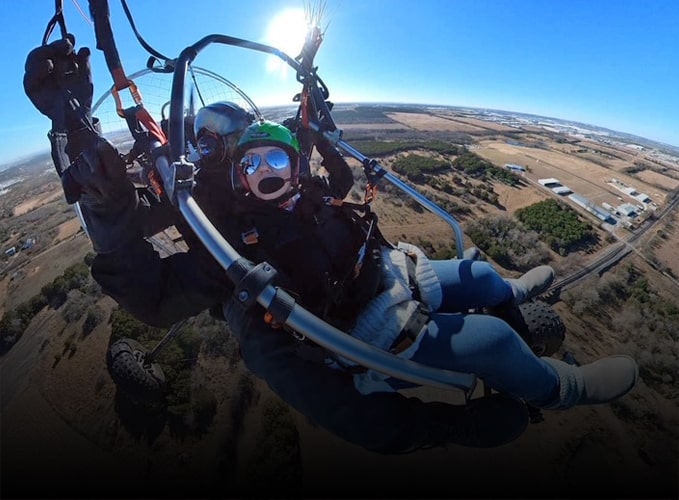 Schedule-Flight-Today-normall Tandem paramotor ride high above the ground.
