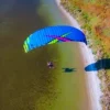 Aerial view of a paramotor pilot in flight using ITV paramotor wings.
