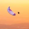 Aerial view of a paramotor pilot in flight using ITV Wasabi paramotor wings.