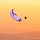 Aerial view of a paramotor pilot in flight using ITV paramotor wings.
