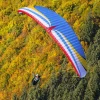 Aerial image of a paramotor pilot flying with MAC Para Illusion 2 Hybrid EN-B wings.