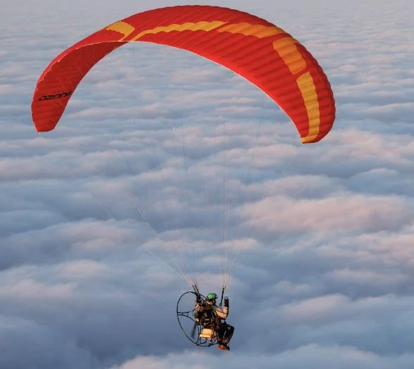 Aerial image of Ozone Kona 3 paramotor wing in flight.