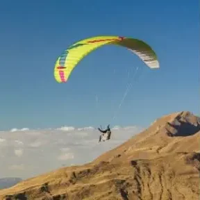 Aerial view of Ozone MoxiePWR paramotor wing in flight.