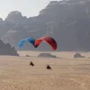 A pair of Ozone Sirocco 3 paramotor wings in flight.