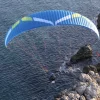 Aerial image of an Ozone Speedster 3 paramotor wing in flight.